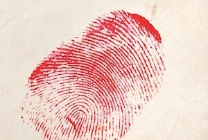 A red fingerprint on aged paper, resembling a crime scene clue. Used to promote the North Coast Men’s Chorus “Murder With a Twist” fundraiser event.