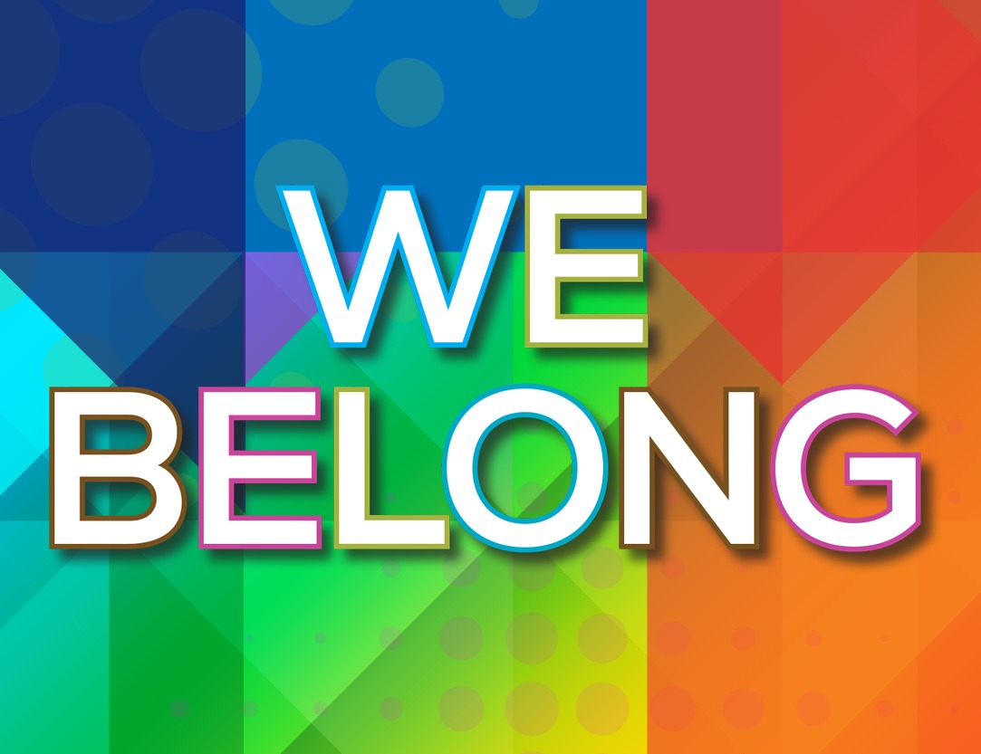 Colorful graphic with bold white text reading “WE BELONG” over a vibrant rainbow mosaic background of geometric shapes and patterns.